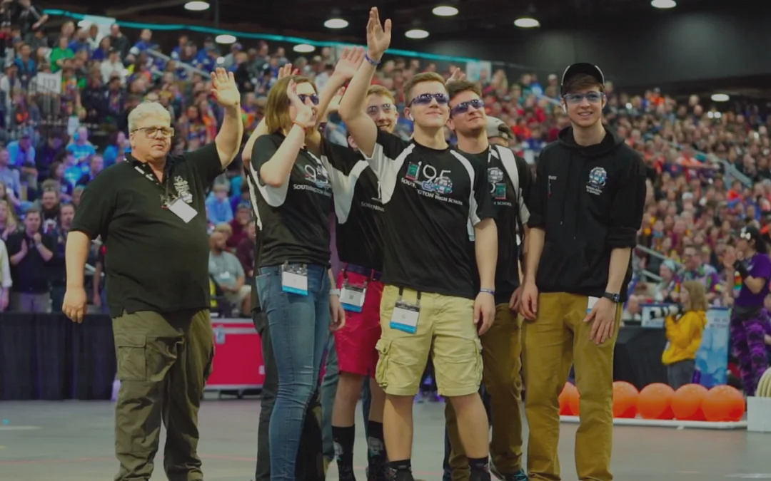 Team 195 students on the field at the FIRST Championship.