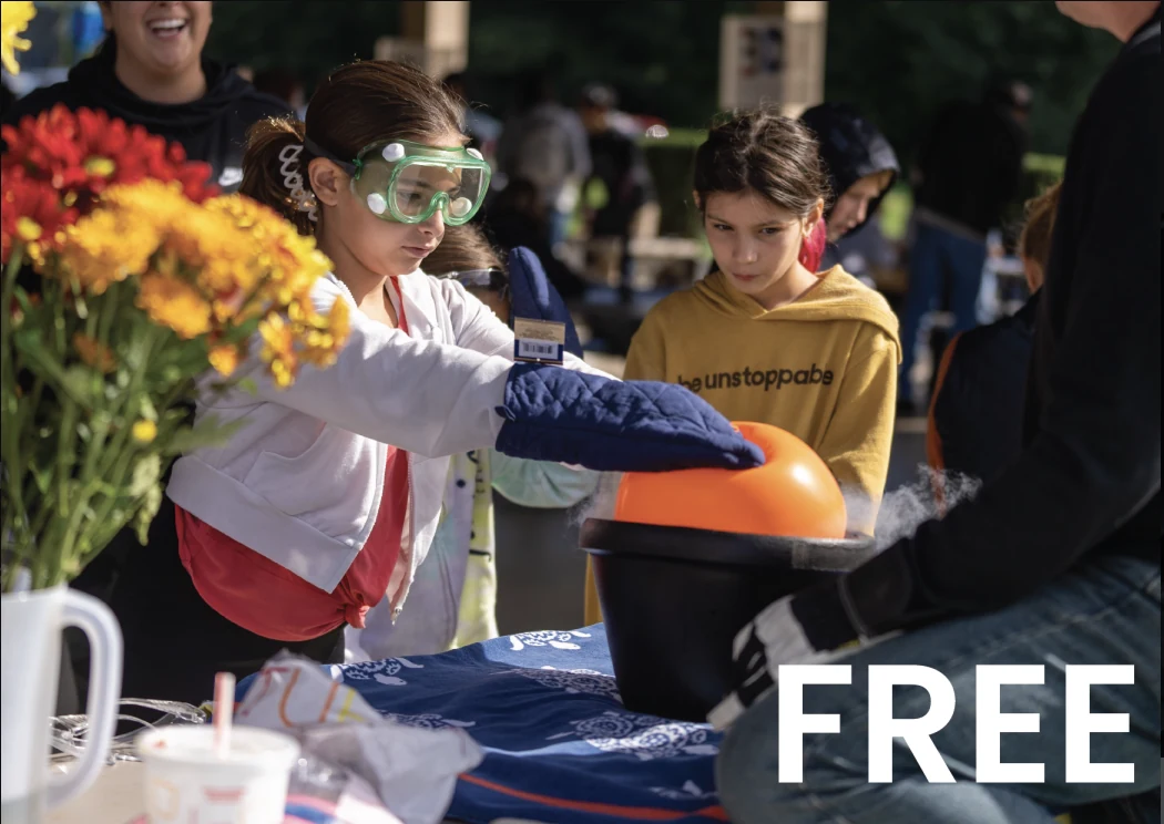 Children taking part in a STEM For All station, with the word FREE across the image.